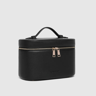 Black travel case with gold zipper on a light gray background