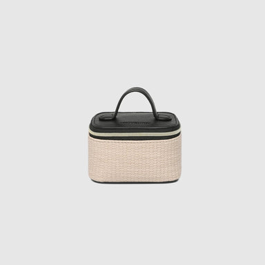 Small woven basket with a black lid on a light gray background