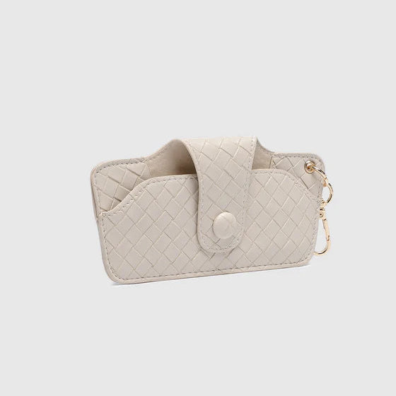 Quilted beige phone case with a chain on a light gray background